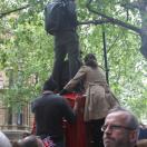 Climbing on phone boxes to get a good view Photo - London, England 