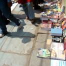 Books lined up on the pavement at Daryaganj Photo - Daryaganj Sunday Book Bazaar, Delhi, India 